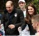 Prince William, Duke of Cambridge is sprayed with water during the London Marathon.