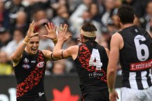 Orazio Fantasia celebrates a goal against Collingwood (AAP: Julian Smith)