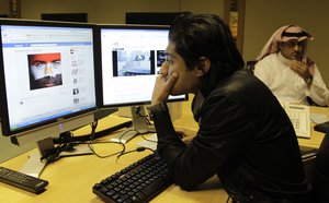 Khaled Al Ghamedi connects his facebook account on his computer at his office in Riyadh, Saudi Arabia