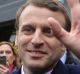 Centrist candidate Emmanuel Macron waves to supporters.