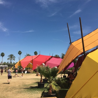 Colourful tents under blue skies.