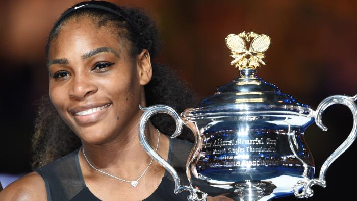 (FILES) This file photo taken on January 28, 2017 shows Serena Williams of the US holding the trophy following her victory over Venus Williams of the US in the women's singles final on day 13 of the Australian Open tennis tournament in Melbourne. Serena Williams is indeed pregnant, her publicist confirmed on April 19, 2017, after the tennis great's Snapchat post suggesting she was expecting a baby. "I'm happy to confirm Serena is expecting a baby this Fall," publicist Kelly Bush Novak said in an email to AFP. / AFP PHOTO / PAUL CROCK / IMAGE RESTRICTED TO EDITORIAL USE - STRICTLY NO COMMERCIAL USE