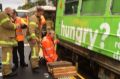 Yarra Trams workers and firefighters worked together to jack up the tram and free the woman.