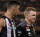 Captain and coach: Scott Pendlebury and Nathan Buckley.