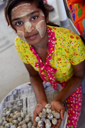 Girl selling eggs on board the ferry to Dala from Yangon.