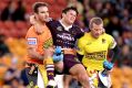 Clipped wings: Broncos paceman and Origin hopeful James Roberts is carried from the field after his leg collided with a ...