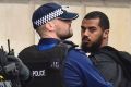 Police detain a man at the scene near Downing Street.