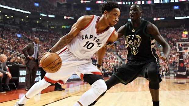 Toronto Raptors guard DeMar DeRozan  drives to the net against Milwaukee Bucks forward Thon Maker.