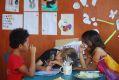 Cabbage and cartooning with friends on the home-school porch.