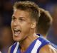 Andrew Swallow makes his case to umpire Robert Findlay amid the ruck free kick confusion.