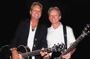 Tanned, in demand and happy to keep coming - America on tour midyear: Gerry Beckley and Dewey Bunnell.