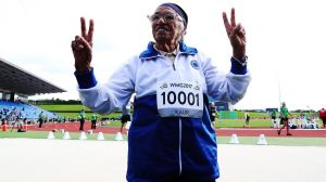  Man Kaur of India celebrates after competing in the 85-year-olds age group 100m sprint at the World Masters Games.