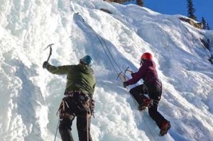 Climbing a frozen waterfall in a Jasper National Park.