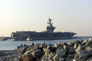 File - Nimitz-class aircraft carrier, USS Carl Vinson pulls into Republic of Korea (ROK) Fleet headquarters in Busan, March 15, 2017.