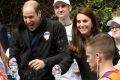 Prince William, Duke of Cambridge is sprayed with water during the London Marathon.