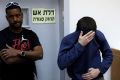 Michael Ron David Kadar, pictured in an Israeli court, was arrested after allegedly threatening schools, airlines, ...