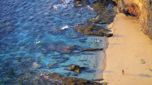 Scenic beach: A figure wanders  on Bali's Bukit Peninsula.