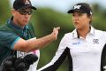 Poor communication: Lydia Ko with caddie Gary Matthews at the Australian Open in February.