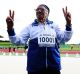  Man Kaur of India celebrates after competing in the 85-year-olds age group 100m sprint at the World Masters Games.