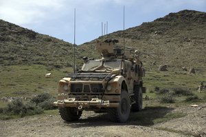 U.S. forces are seen Asad Khil village near the site of a U.S. bombing in the Achin district of Jalalabad, east of Kabul, Afghanistan, Saturday, April 17, 2017. U.S