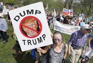 People gather for a climate rally on Boston Common in Boston, Saturday, April 29, 2017. Organizers say they’re marking President Donald Trump’s first 100 days in office by protesting his agenda so far.