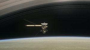 In the still from the short film Cassini's Grand Finale, the spacecraft is shown diving between Saturn and the planet's innermost ring.