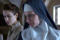 Lou de Laage as Mathilde (left) and Agata Buzek as Sister Maria in <i>The Innocents</i>.
