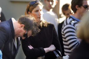 Winning bidders looking stressed at a Surry Hills auction in Sydney: Make sure you can afford a property before you bid ...