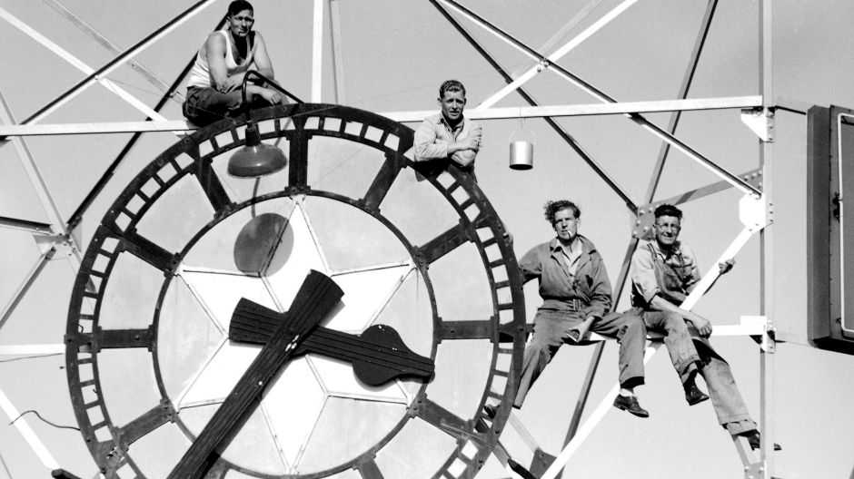 Workers paint and clean the Feltex Clock on the Rowan Bond building in Sydney on 11 October 1946. SMH NEWS Picture by ...