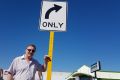 People pulling out look out at the road, not up at this sign, Mr Carruthers says - and those pulling in can't see it at all. 