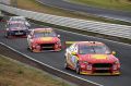 The Shell V-Power Racing Ford Falcons of New Zealanders Fabian Coulthard and Scott McLaughlin beat the Triple Eight ...