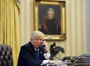 In this Saturday, Jan. 28, 2017 file photo, President Donald Trump speaks on the phone with Prime Minister of Australia Malcolm Turnbull in the Oval Office of the White House, in from of a portrait of former president Andrew Jackson, in Washington. Trump is likely to make the case at a Nashville rally to gut and replace former President Barack Obama's signature health care law. But first, he’ll lay a wreath just outside the city at Andrew  Jackson’s historic home, the Hermitage. Trump has echoed Jackson’s populist, outsider message to rural America by pledging to be a voice for the “forgotten men and women of our country.” (AP Photo/Alex Brandon, File)