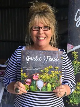 Cookbook author Janice Sutton with her new cookbook Garlic Feast. For The Grill by Penny McLeod tasweekend 21 May