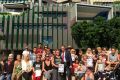 The supporters of Chase Walker-Steven, Cini Walker and Marc Alexander Steven outside the Lady Cilento Children's Hospital.