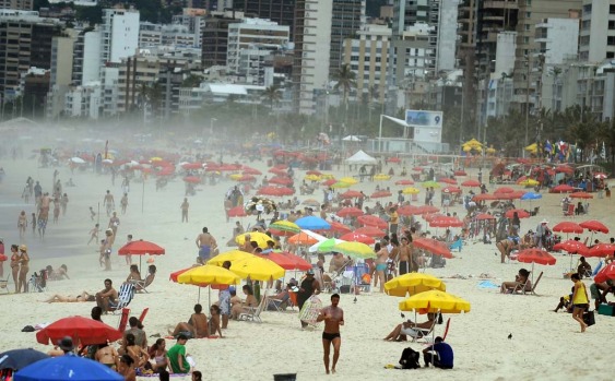 People enjoy at Ipanema beach in Rio de Janeiro as summer arrives.