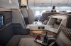 Passenger seats sit in the business class cabin of an Airbus SE A350 aircraft, operated by Singapore Airlines Ltd., ...