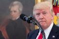 A portrait of former US president Andrew Jackson hangs on the wall behind President Donald Trump, accompanied by Vice ...