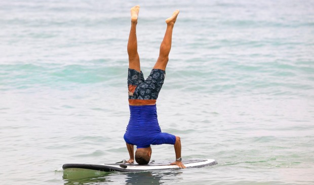 Peter Kuruvita has mastered balancing on his stand-up paddle board.