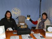 Royal Australian Mint stall with the AIATSIS 50th anniversary coin, Shaun Frater and Carolyn Skene.