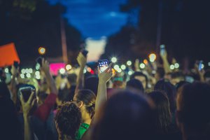 Community members and Black Lives Matter shine lights from mobile phones (smartphones) during a protests outside the Minnesota Governor's mansion the evening of July 7, 2016, on Summit Avenue in Saint Paul, Minnesota