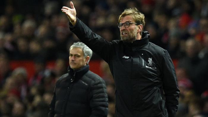 Manchester United's Portuguese manager Jose Mourinho (L) looks on as Liverpool's German manager Jurgen Klopp shouts instructions to his players from the touchline during the English Premier League football match between Manchester United and Liverpool at Old Trafford in Manchester, north west England, on January 15, 2017. / AFP PHOTO / Oli SCARFF / RESTRICTED TO EDITORIAL USE. No use with unauthorized audio, video, data, fixture lists, club/league logos or 'live' services. Online in-match use limited to 75 images, no video emulation. No use in betting, games or single club/league/player publications. /