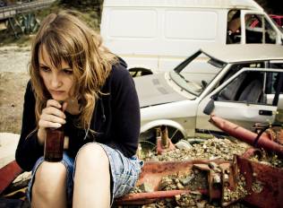 A stressed woman with beer.