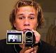 Heath Ledger records himself with a handycam.