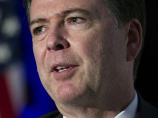 FILE - In this March 29, 2017 file photo, FBI Director James Comey speaks in Alexandria, Va. Don't expect Comey to reveal much about the bureau's months-long investigation of potential coordination between the Trump campaign and Russia when he speaks publicly before members of Congress on Wednesday, May 3, 2017. (AP Photo/Cliff Owen, File)