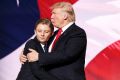 Donald Trump embraces his son Barron.