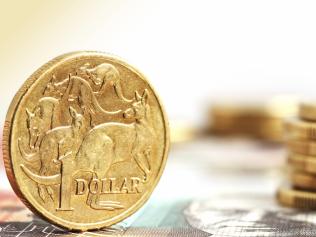 Generic photo of an Australian dollar coin .. Aussie one dollar coins, on a twenty dollar note.