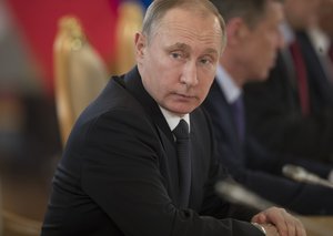 Russian President Vladimir Putin listens to Uzbek President Shavkat Mirziyoyev during their talks in Moscow's Kremlin, Russia, Wednesday, April 5, 2017. Mirziyoyev is in Russia on an official visit.