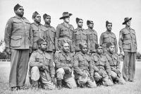 Group portrait of the special platoon consisting of Aboriginal soldiers, all volunteers, at Number 9 camp at Wangaratta with Corporal Mullett (left), Major Joseph Albert Wright (centre) and Sergeant Morris (right). Major Wright, a World War 1 Light Horse veteran, was in charge of this Platoon, which was the only Aboriginal squad in the Australian military forces. 