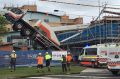 The driver of this crane broke his leg when it toppled at a building site in Taree. 