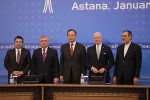 From left, Turkish Foreign Ministry Deputy Undersecretary Sedat Onal, Russia's special envoy on Syria Alexander Lavrentiev, Kazakh Foreign Minister Kairat Abdrakhmanov, UN Syria envoy Staffan de Mistura and Iran's Deputy Foreign Minister Hossein Jaber Ansari pose for a photo after the final statement following the talks on Syrian peace in Astana, Kazakhstan, Tuesday, Jan. 24, 2017.